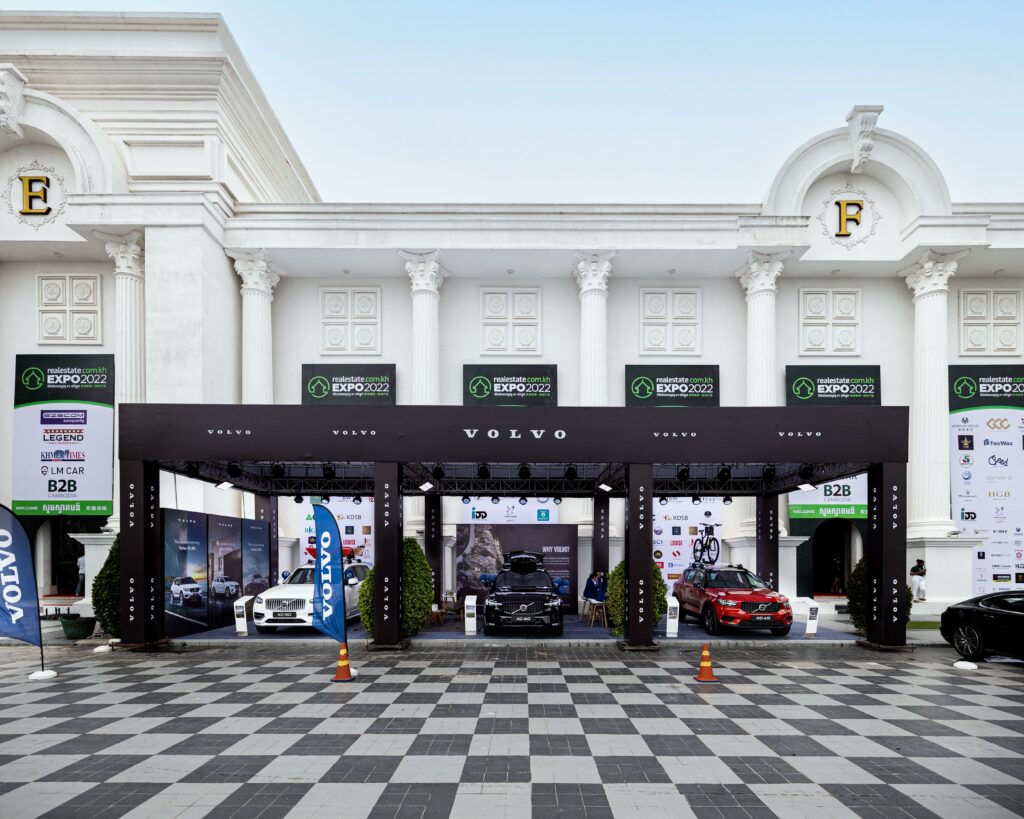 A modern Volvo car exhibition showcasing vehicles at a stylish venue in Cambodia.